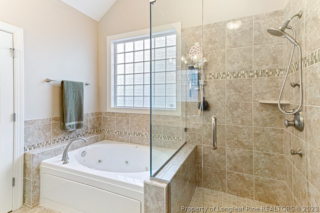 645 Little Bridge Road Fayetteville, NC 28311 - Photo 28 of 49 a bathroom with a bathtub and shower