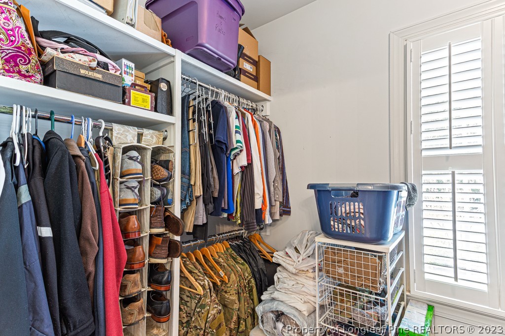 645 Little Bridge Road Fayetteville, NC 28311 - Photo 29 of 49 a view of walk in closet with clothes