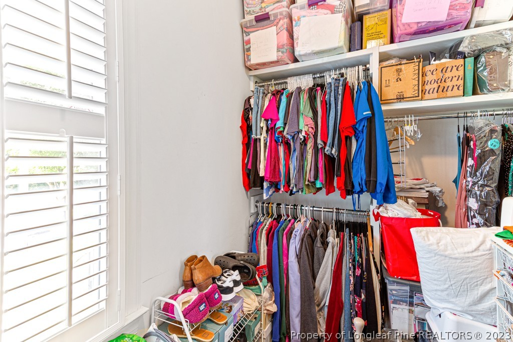 645 Little Bridge Road Fayetteville, NC 28311 - Photo 30 of 49 a view of walk in closet with clothes