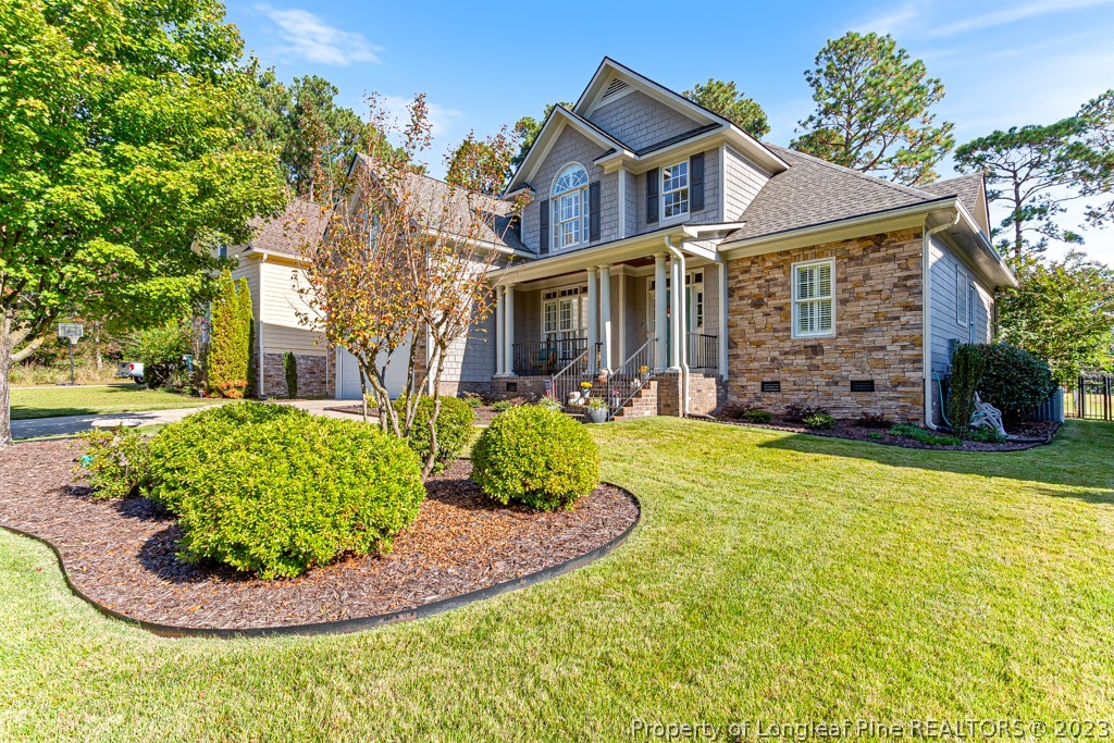 645 Little Bridge Road Fayetteville, NC 28311 - Photo 3 of 49 front view of house with a yard