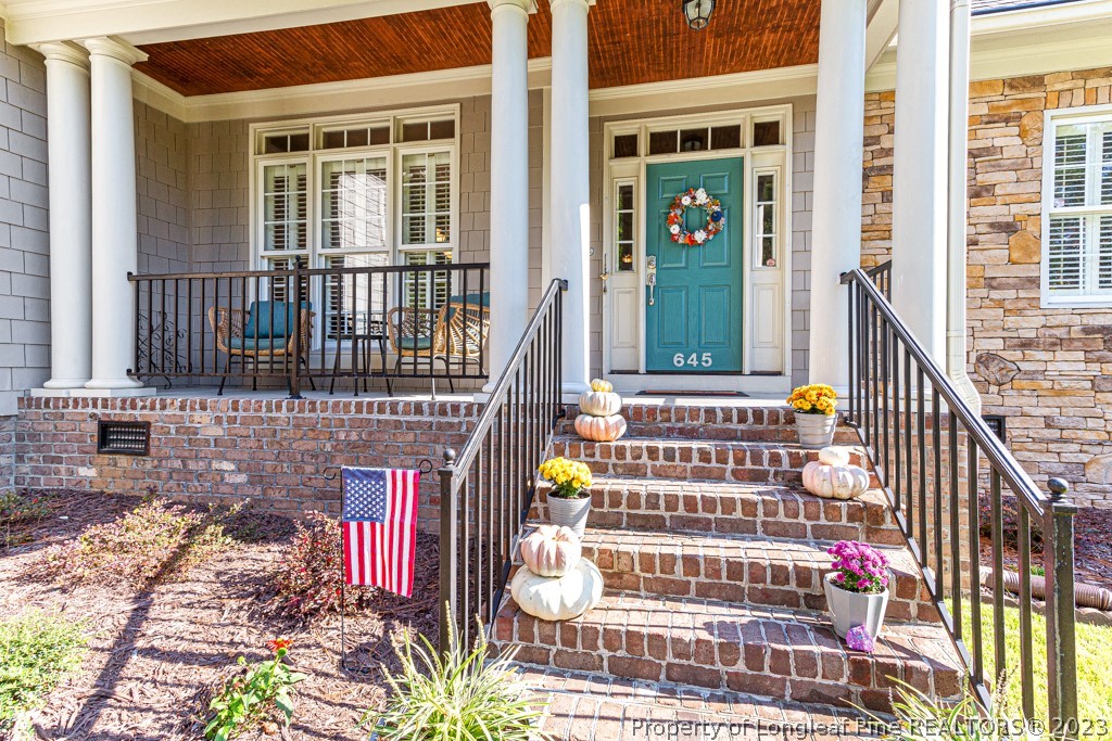 645 Little Bridge Road Fayetteville, NC 28311 - Photo 4 of 49 a front view of a house with a garden