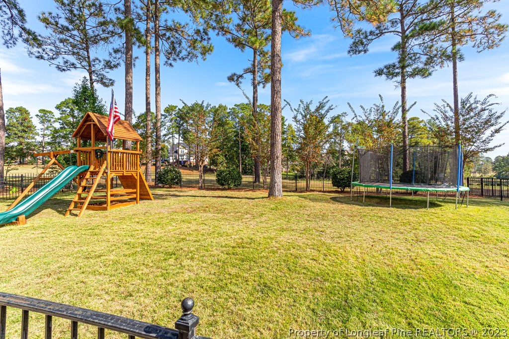645 Little Bridge Road Fayetteville, NC 28311 - Photo 42 of 49 a view of a swimming pool with an outdoor space