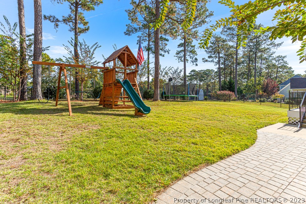 645 Little Bridge Road Fayetteville, NC 28311 - Photo 43 of 49 a view of a swimming pool with a lounge chairs