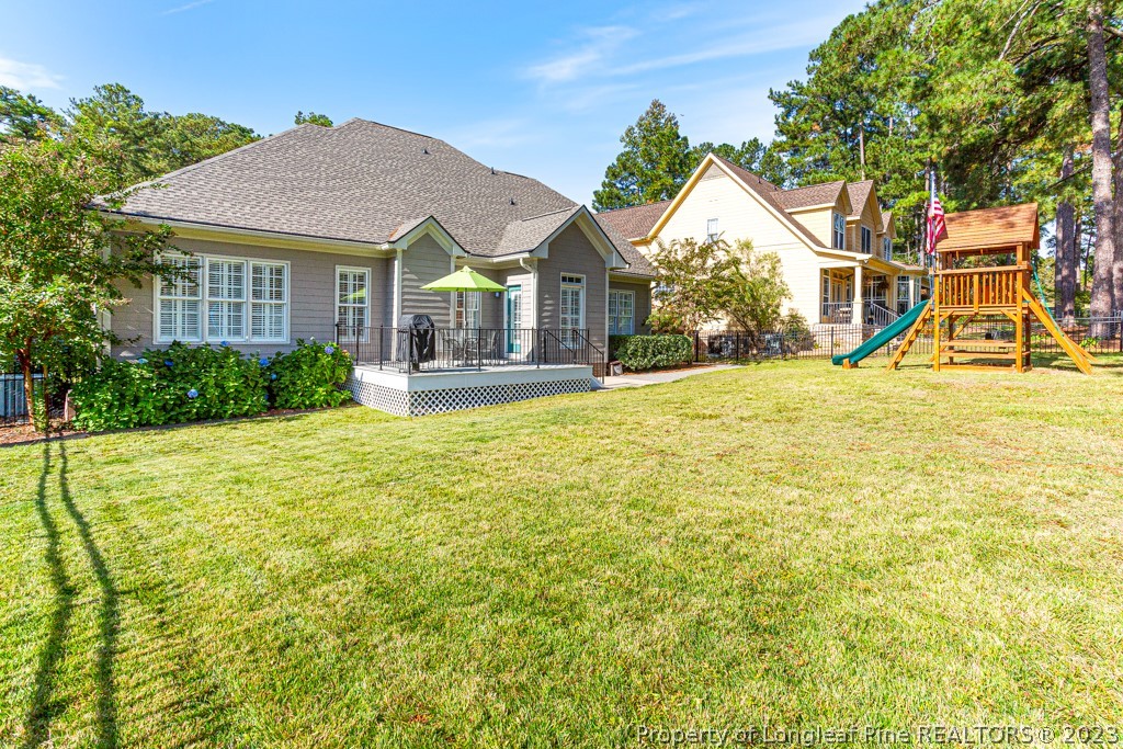 645 Little Bridge Road Fayetteville, NC 28311 - Photo 46 of 49 a view of a house with a yard and sitting area