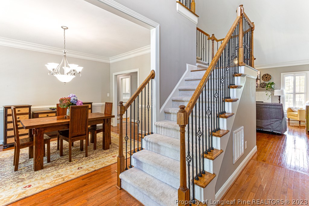 645 Little Bridge Road Fayetteville, NC 28311 - Photo 7 of 49 a view of a dining room with furniture and wooden floor