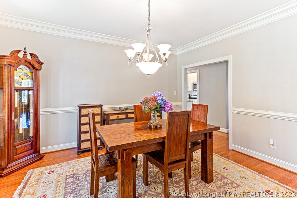 645 Little Bridge Road Fayetteville, NC 28311 - Photo 8 of 49 a view of a dining room with furniture and chandelier