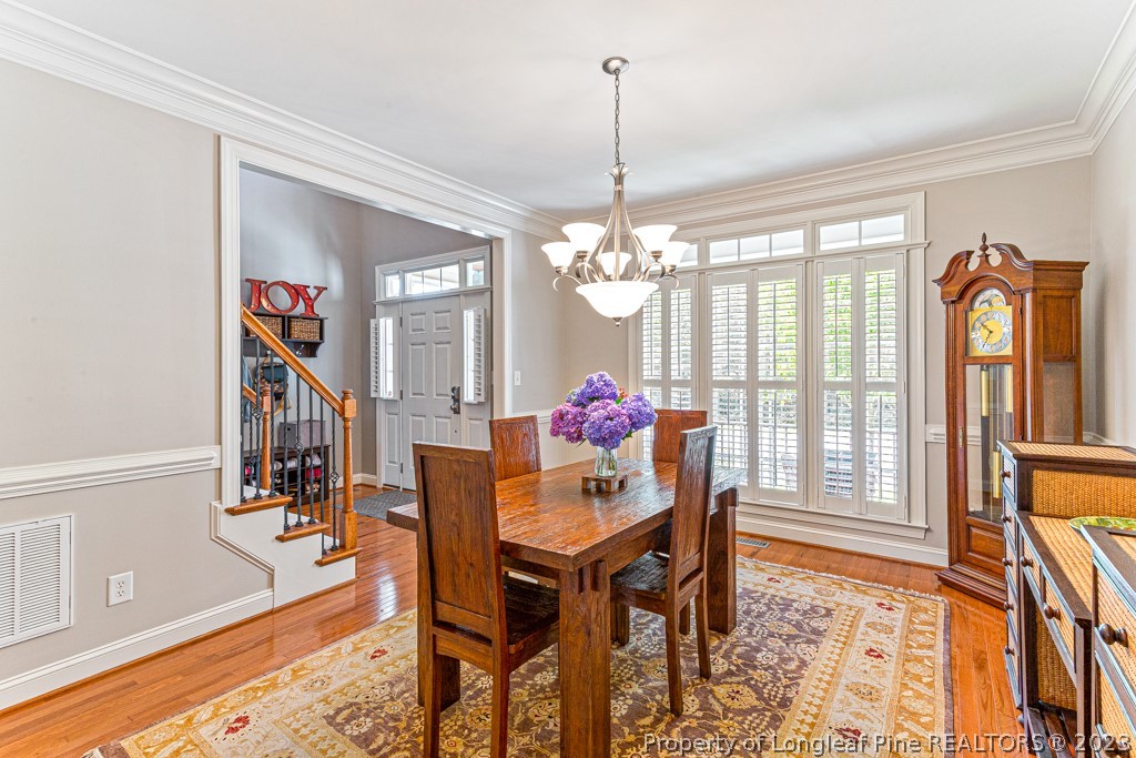 645 Little Bridge Road Fayetteville, NC 28311 - Photo 9 of 49 a view of a dining room with furniture and a chandelier