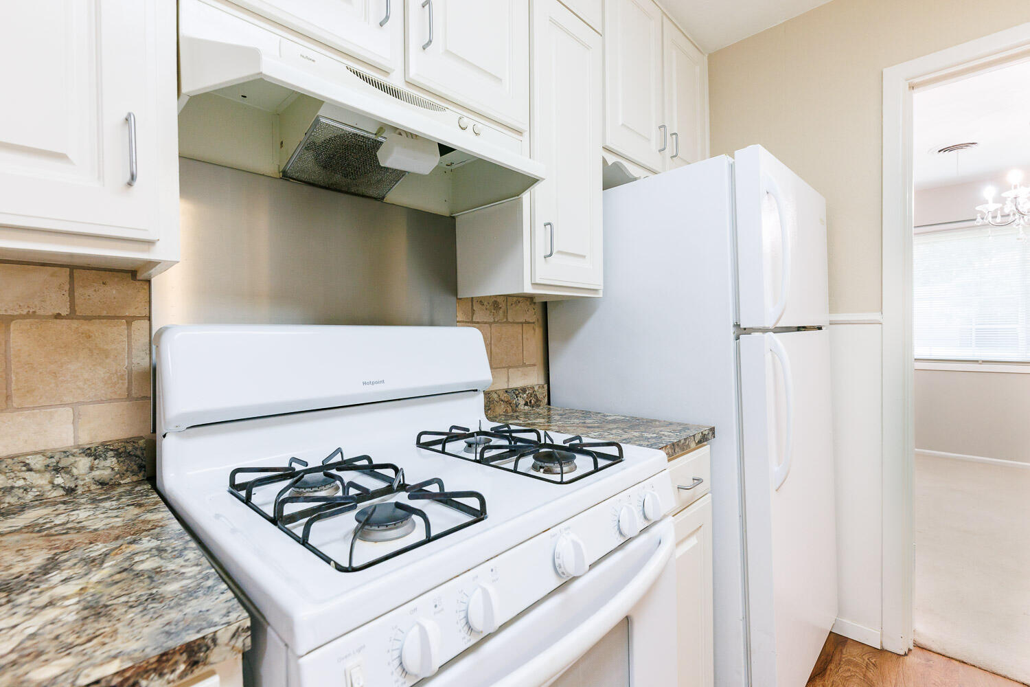 3816 53rd Street Lubbock, TX 79413 - Photo 16 of 59 a white refrigerator freezer sitting inside of a kitchen