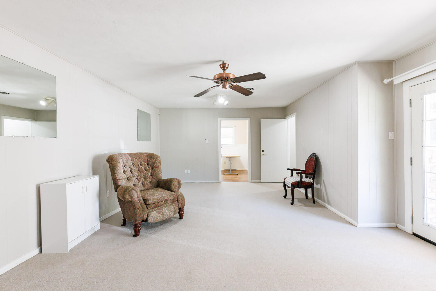 3816 53rd Street Lubbock, TX 79413 - Photo 20 of 59 a living room with furniture and a ceiling fan
