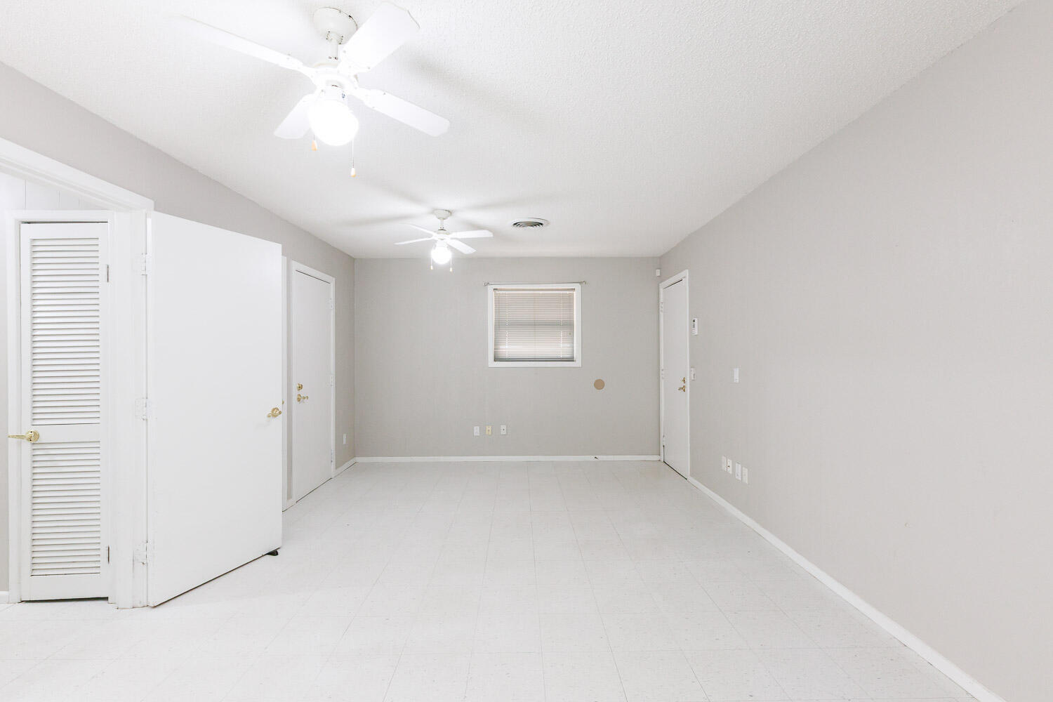 3816 53rd Street Lubbock, TX 79413 - Photo 27 of 59 an empty room with a ceiling fan and a window
