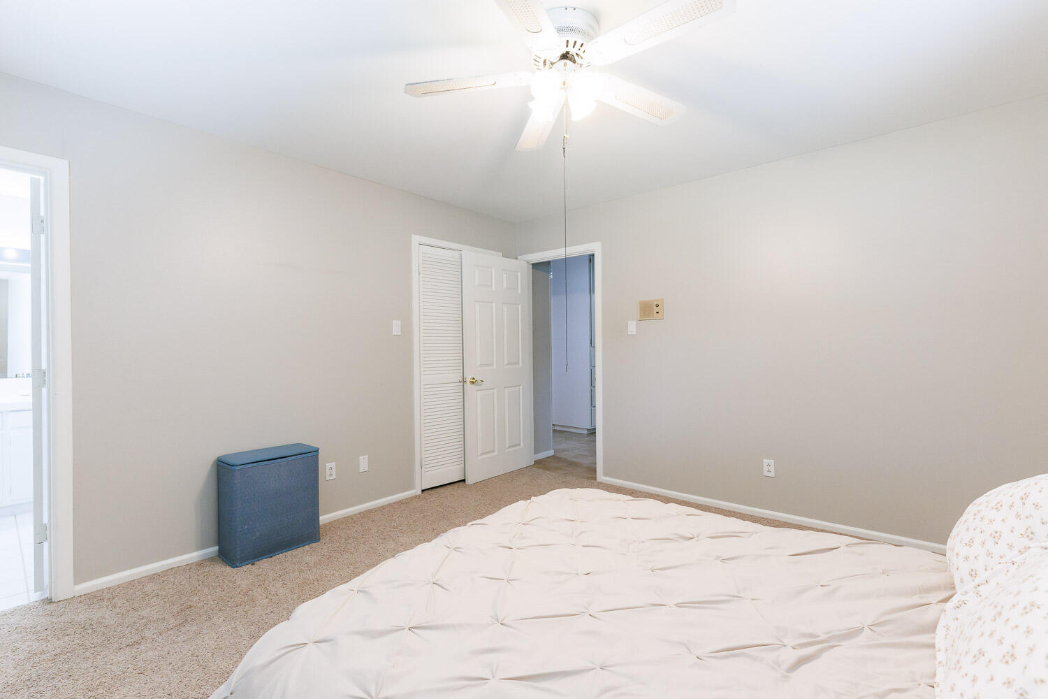 3816 53rd Street Lubbock, TX 79413 - Photo 29 of 59 a bedroom with a bed and a chandelier