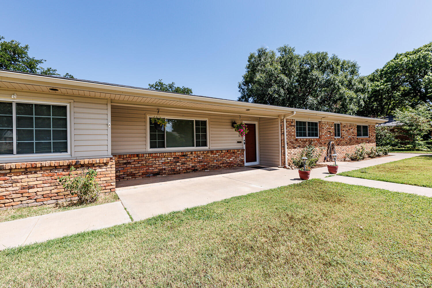 3816 53rd Street Lubbock, TX 79413 - Photo 3 of 59 a view of a house with patio and a yard