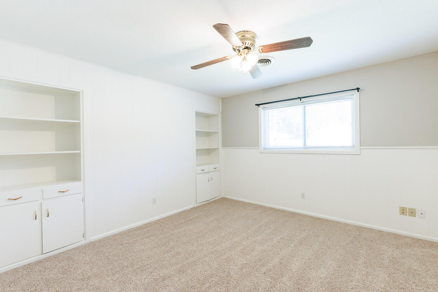 3816 53rd Street Lubbock, TX 79413 - Photo 39 of 59 an empty room with a window and a fan