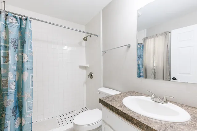 a kitchen with stainless steel appliances granite countertop a stove and a refrigerator