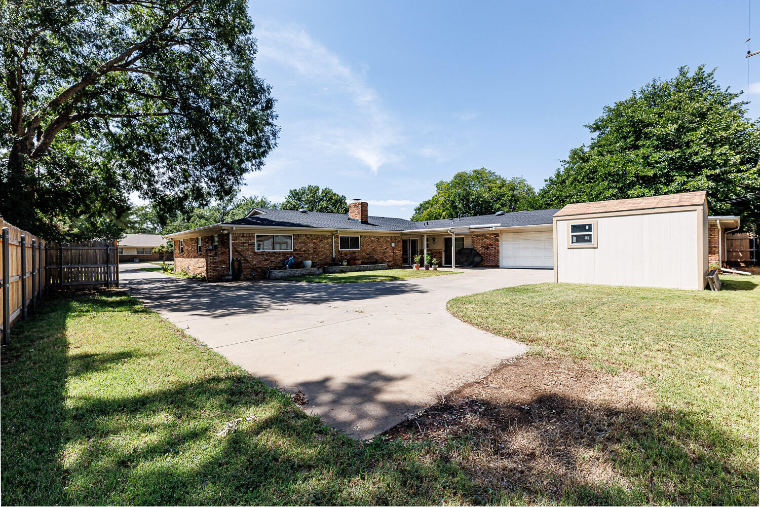 3816 53rd Street Lubbock, TX 79413 - Photo 56 of 59 a front view of a house with a yard and a porch
