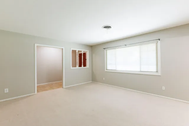 a view of a kitchen with cabinet and chandelier
