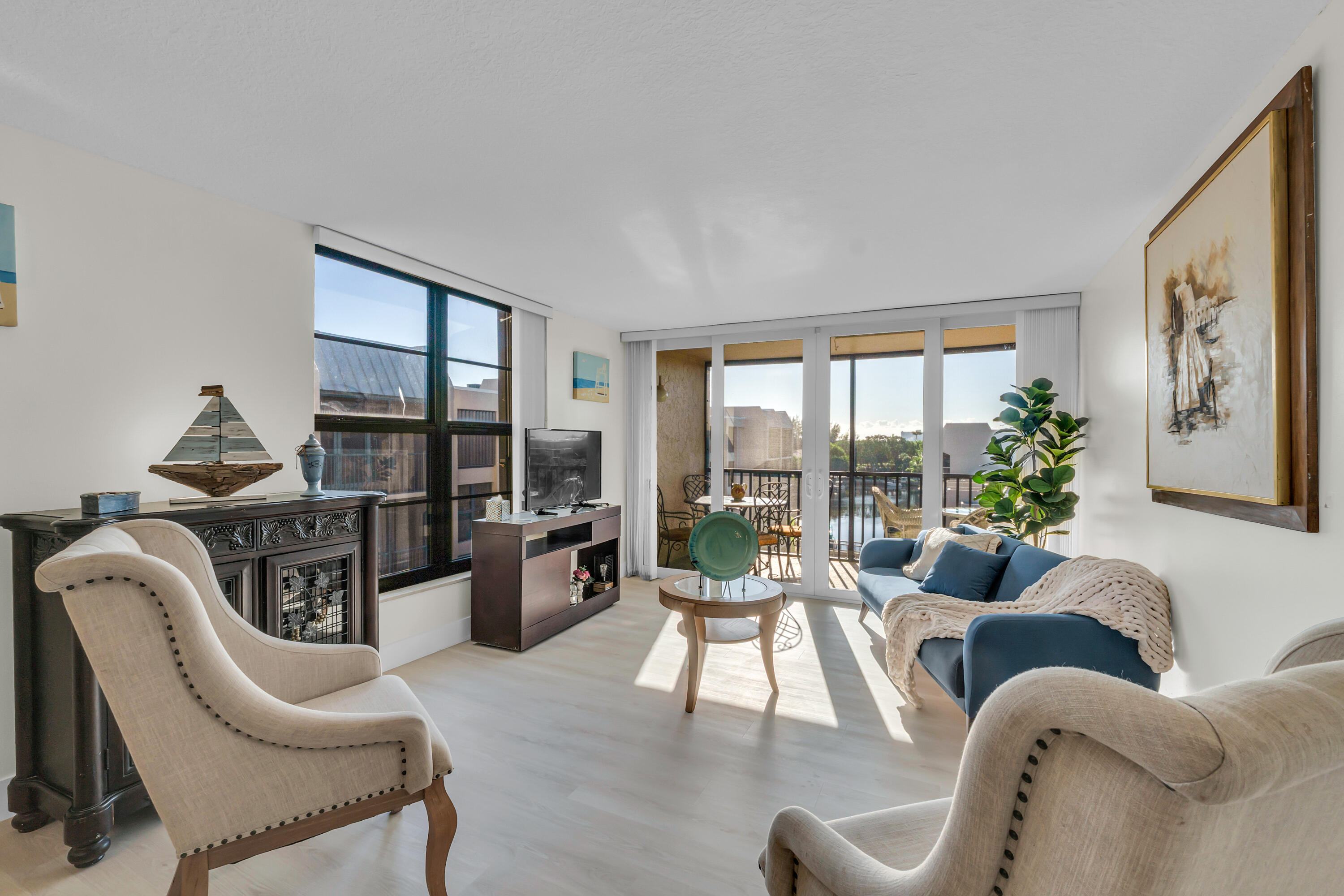 4 Royal Palm Way, Unit 601 Boca Raton, FL 33432 - Photo 12 of 34 a living room with furniture and floor to ceiling windows