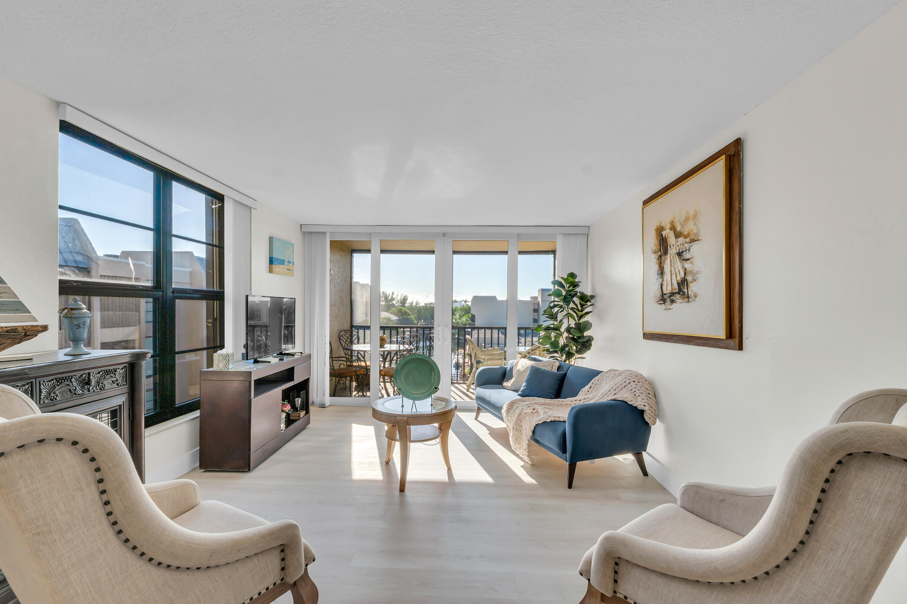 4 Royal Palm Way, Unit 601 Boca Raton, FL 33432 - Photo 13 of 34 a living room with furniture large window and wooden floor