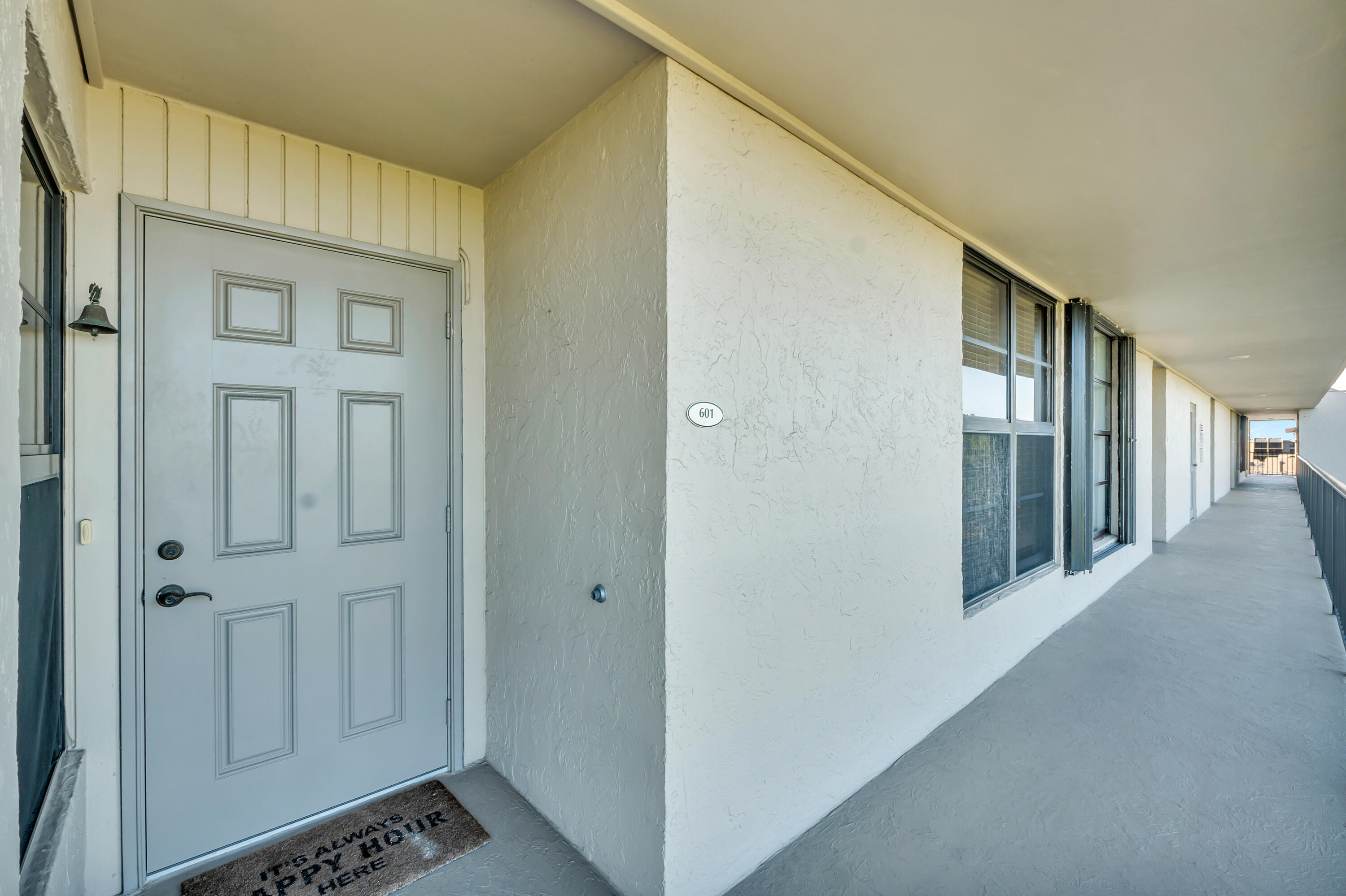 4 Royal Palm Way, Unit 601 Boca Raton, FL 33432 - Photo 2 of 34 a view of a hallway with wooden shelves