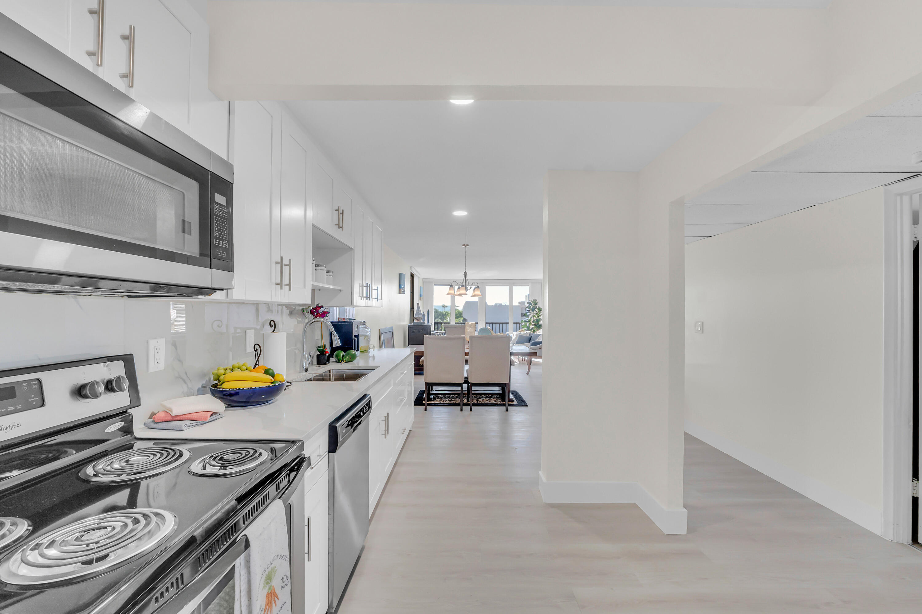 4 Royal Palm Way, Unit 601 Boca Raton, FL 33432 - Photo 5 of 34 a kitchen with a sink a stove and cabinets