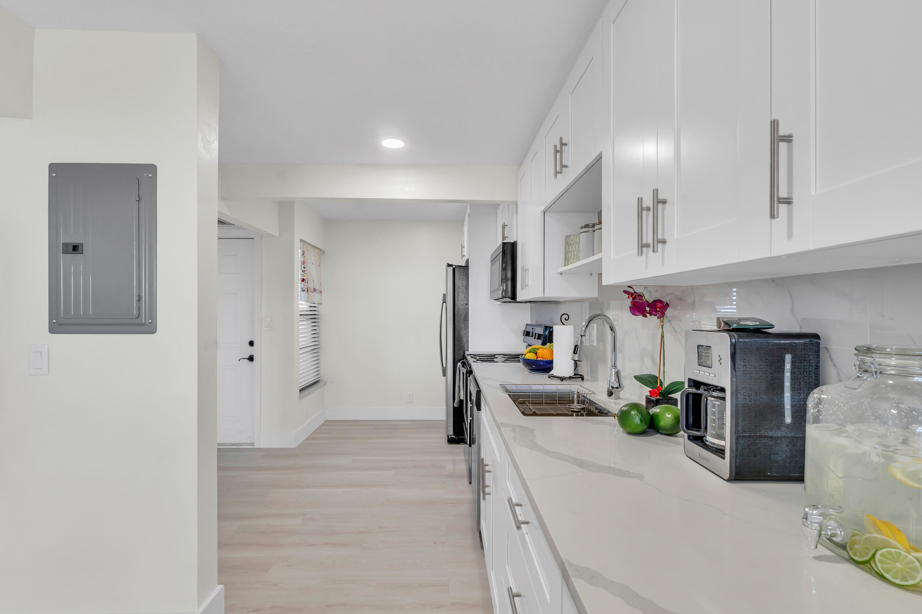 4 Royal Palm Way, Unit 601 Boca Raton, FL 33432 - Photo 7 of 34 a kitchen with stainless steel appliances a refrigerator a sink a stove and white cabinets