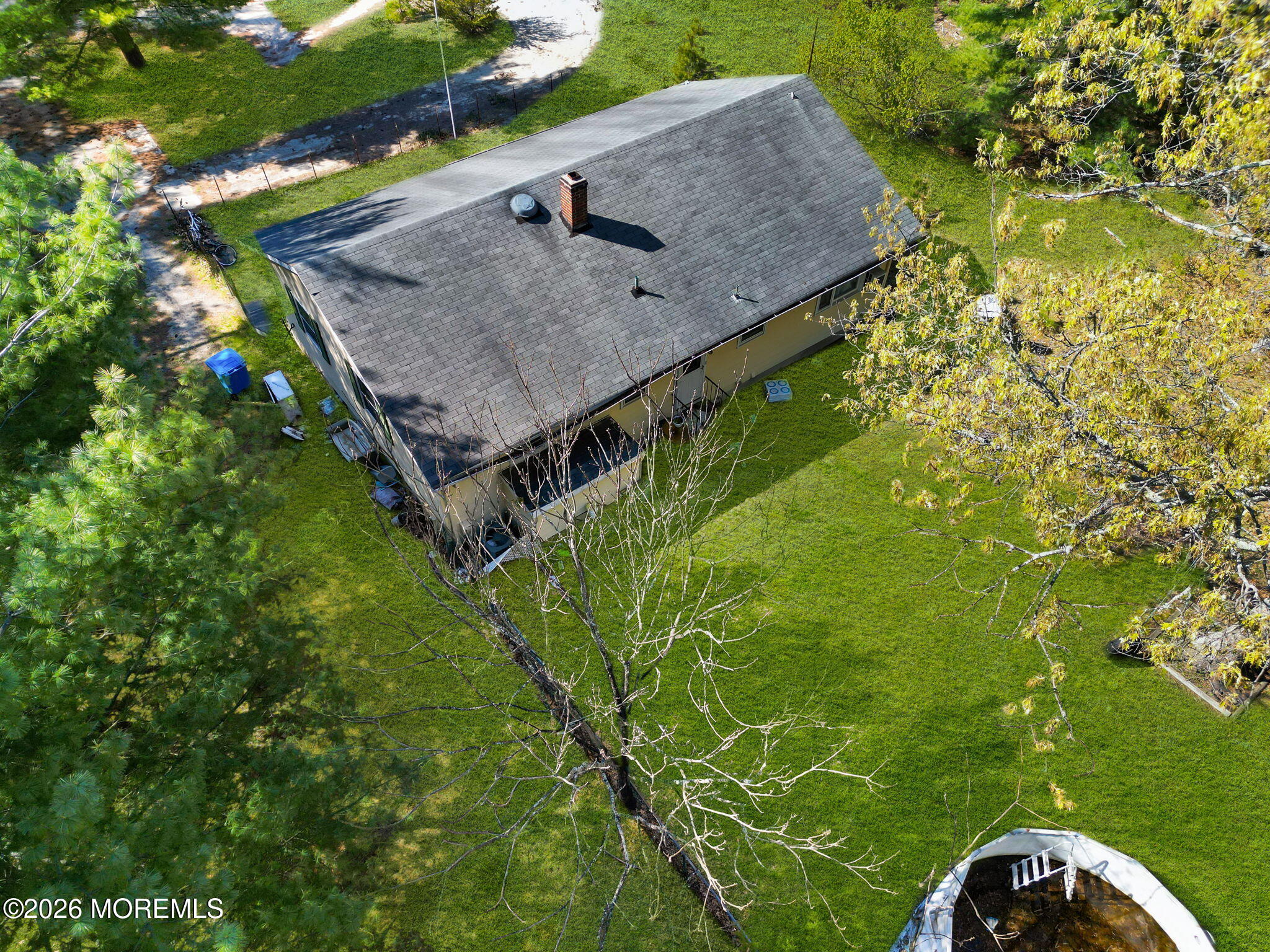 635 Bennetts Mills Road Jackson, NJ 08527 - Photo 3 of 18 a view of a house with a backyard and trees