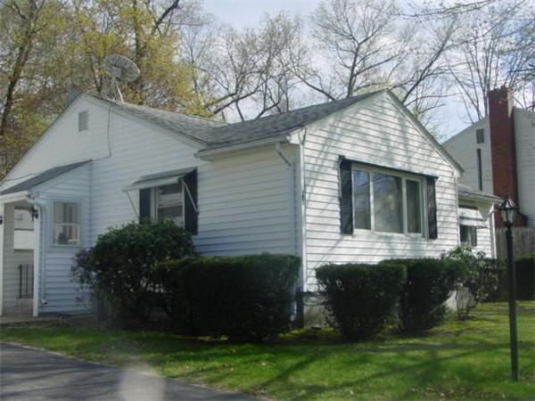 185 Roy Street Springfield, MA 01104 - Photo 3 of 8 a view of a house with a yard