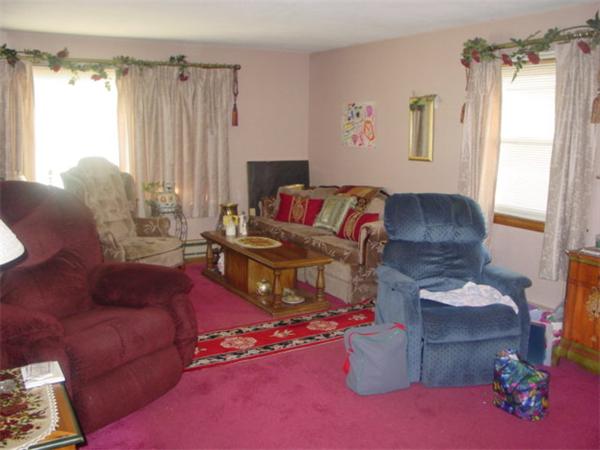 185 Roy Street Springfield, MA 01104 - Photo 5 of 8 a living room with furniture and a window
