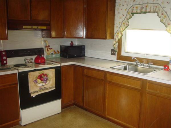 185 Roy Street Springfield, MA 01104 - Photo 8 of 8 a kitchen with a sink and cabinets