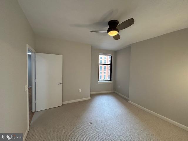 400 Massachusetts Avenue Northwest, Unit 608 Washington, DC 20001 - Photo 12 of 25 an empty room with windows and fan