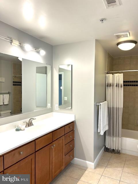 400 Massachusetts Avenue Northwest, Unit 608 Washington, DC 20001 - Photo 14 of 25 a bathroom with a double vanity sink and a mirror