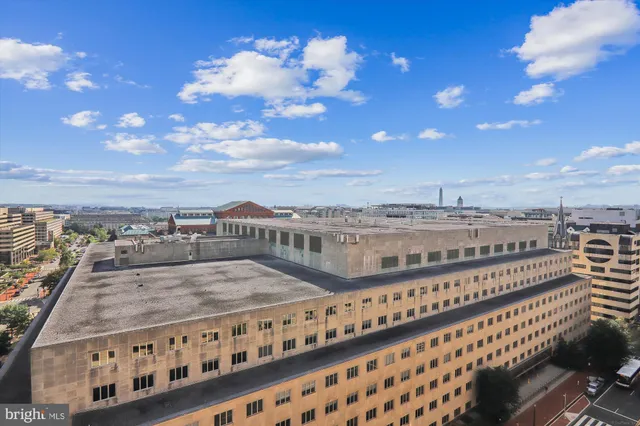 a view of a balcony with an outdoor seating