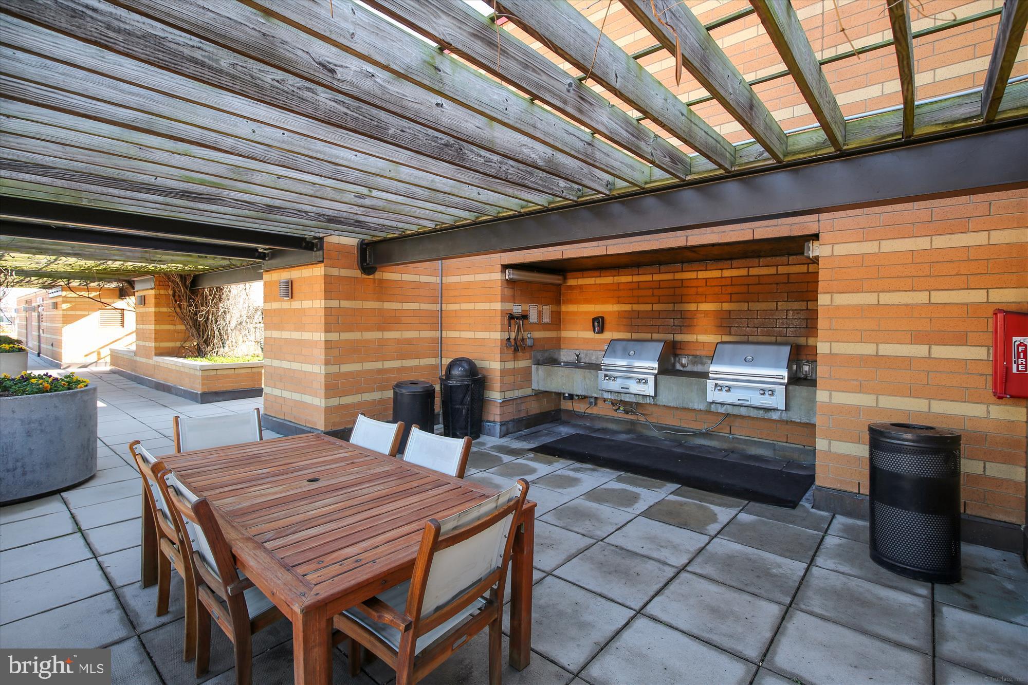 400 Massachusetts Avenue Northwest, Unit 608 Washington, DC 20001 - Photo 20 of 25 a outdoor space with sitting area