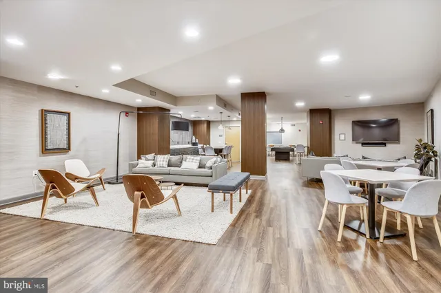 a view of a dining room with furniture wooden floor and a rug