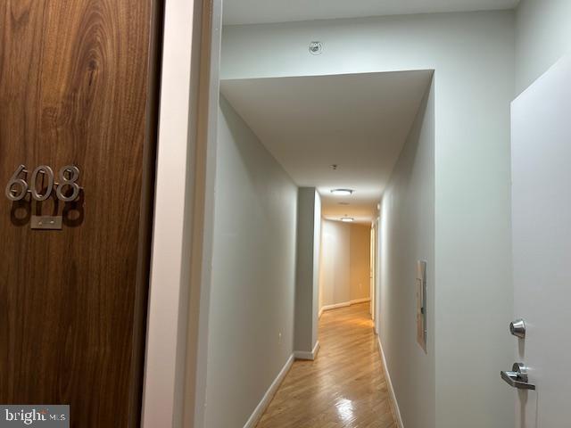 400 Massachusetts Avenue Northwest, Unit 608 Washington, DC 20001 - Photo 3 of 25 a view of a hallway with wooden floor