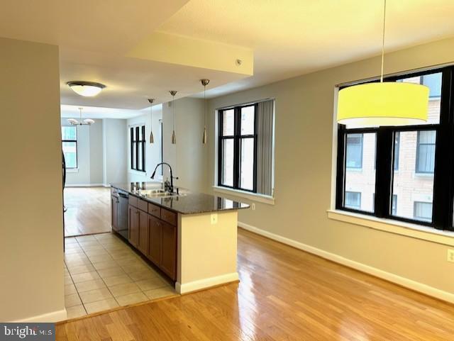 400 Massachusetts Avenue Northwest, Unit 608 Washington, DC 20001 - Photo 5 of 25 a large kitchen with stainless steel appliances granite countertop a large counter top and a stove