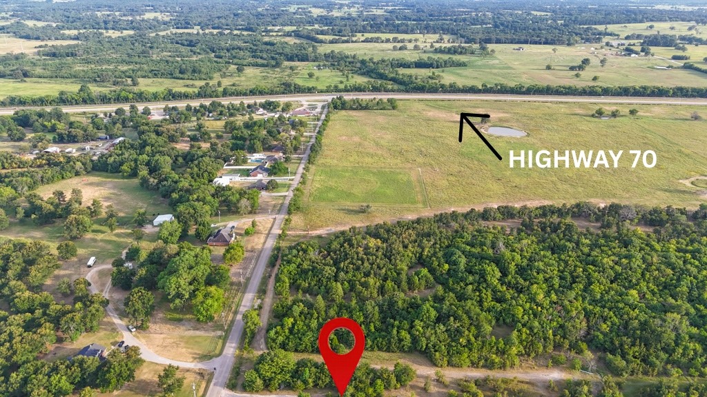 0 Deer Run Road North Hugo, OK 74743 - Photo 5 of 6 Expansive land parcel with significant tree coverage and open fields