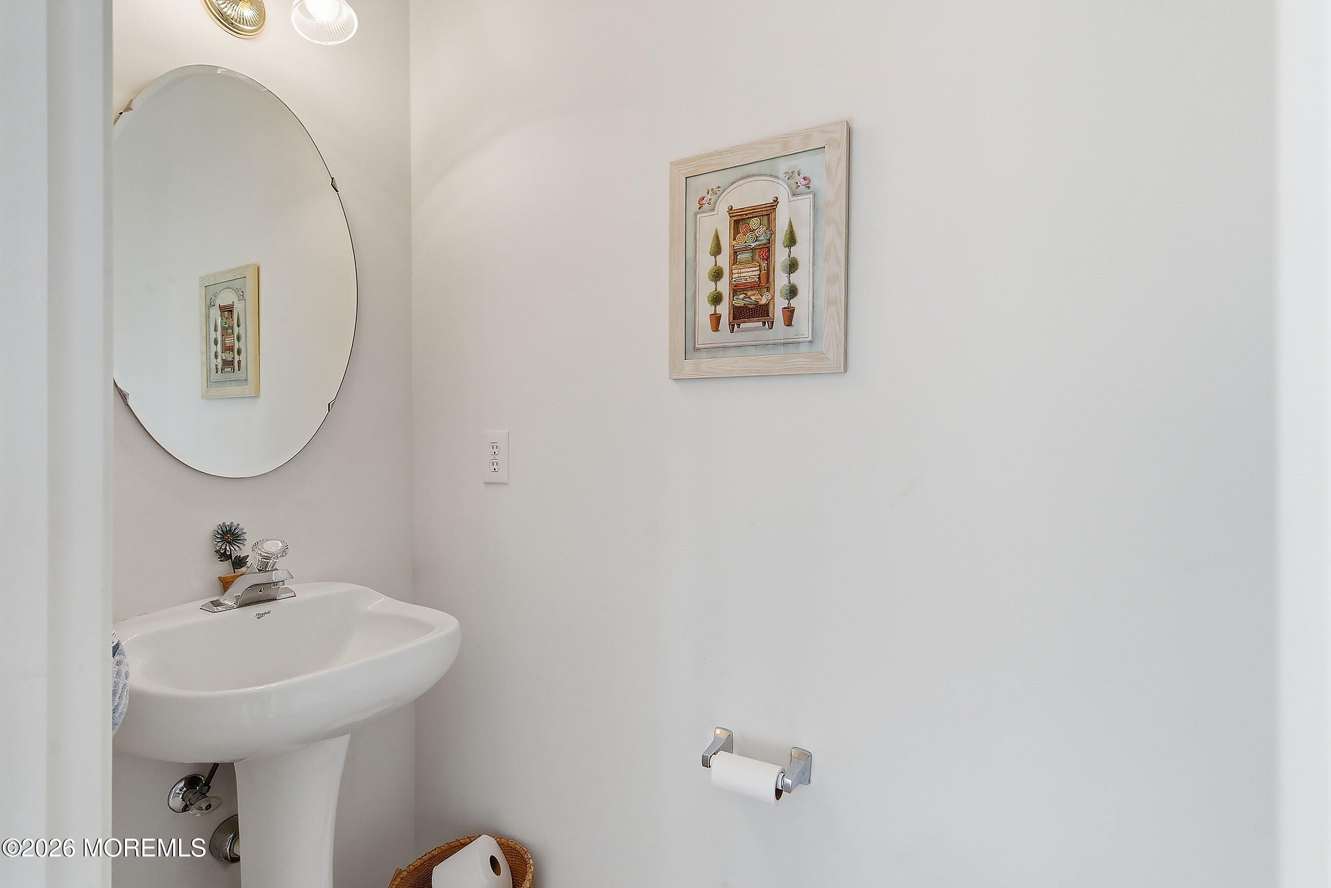 15 Benjamin Court Barnegat, NJ 08005 - Photo 11 of 24 a bathroom with a sink mirror and vanity
