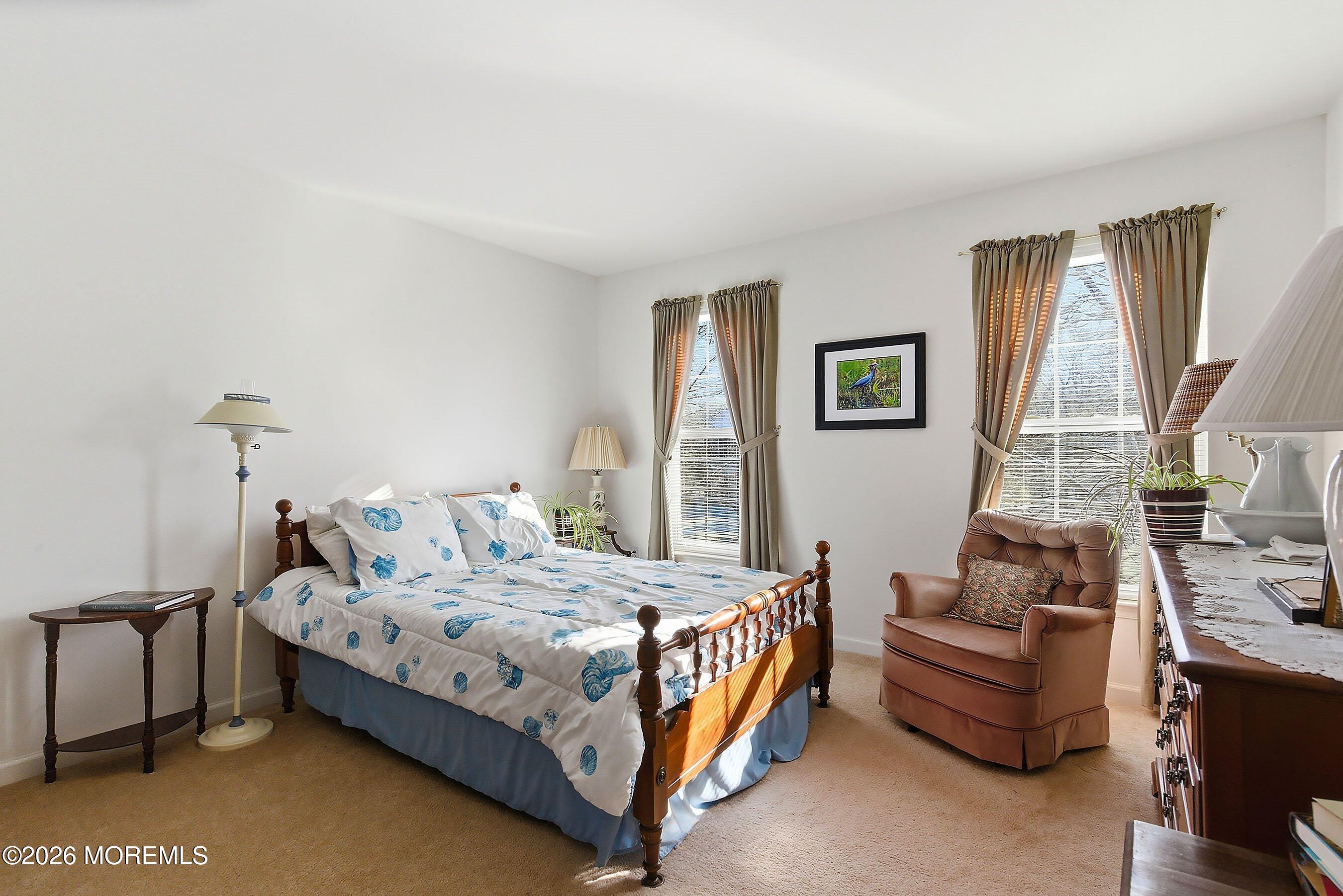 15 Benjamin Court Barnegat, NJ 08005 - Photo 15 of 24 a bedroom with a bed couch and a large window