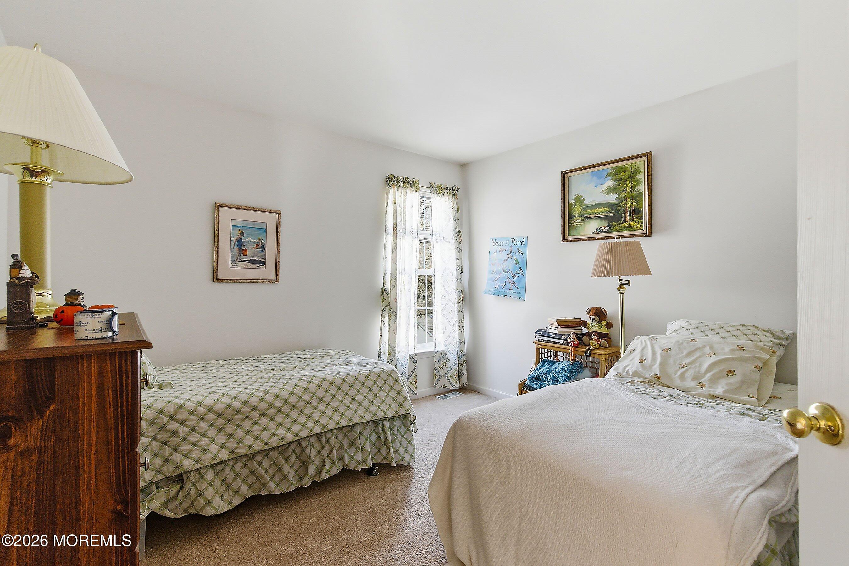 15 Benjamin Court Barnegat, NJ 08005 - Photo 16 of 24 a bedroom with a bed and wooden floor