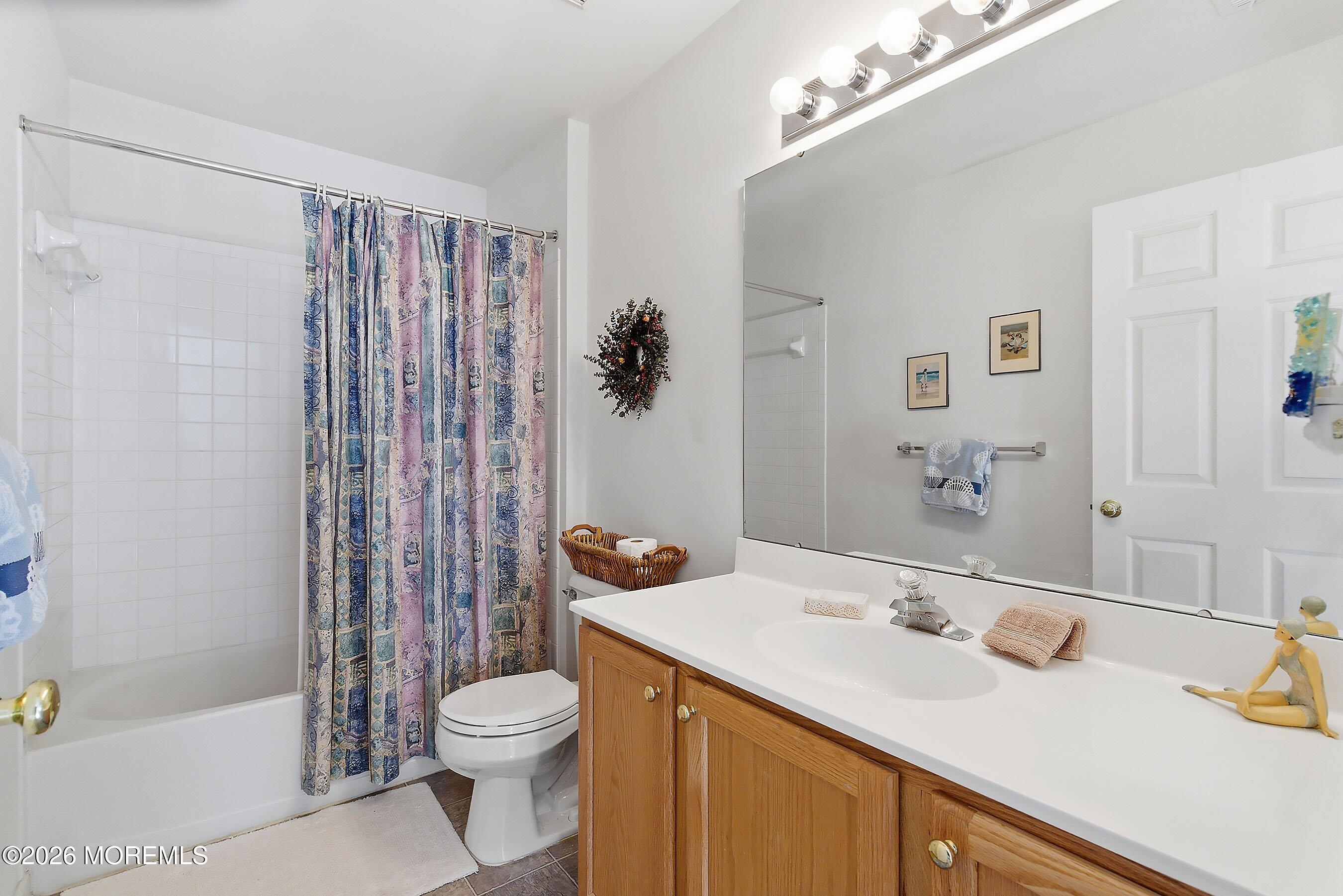 15 Benjamin Court Barnegat, NJ 08005 - Photo 18 of 24 a bathroom with a sink a toilet and shower
