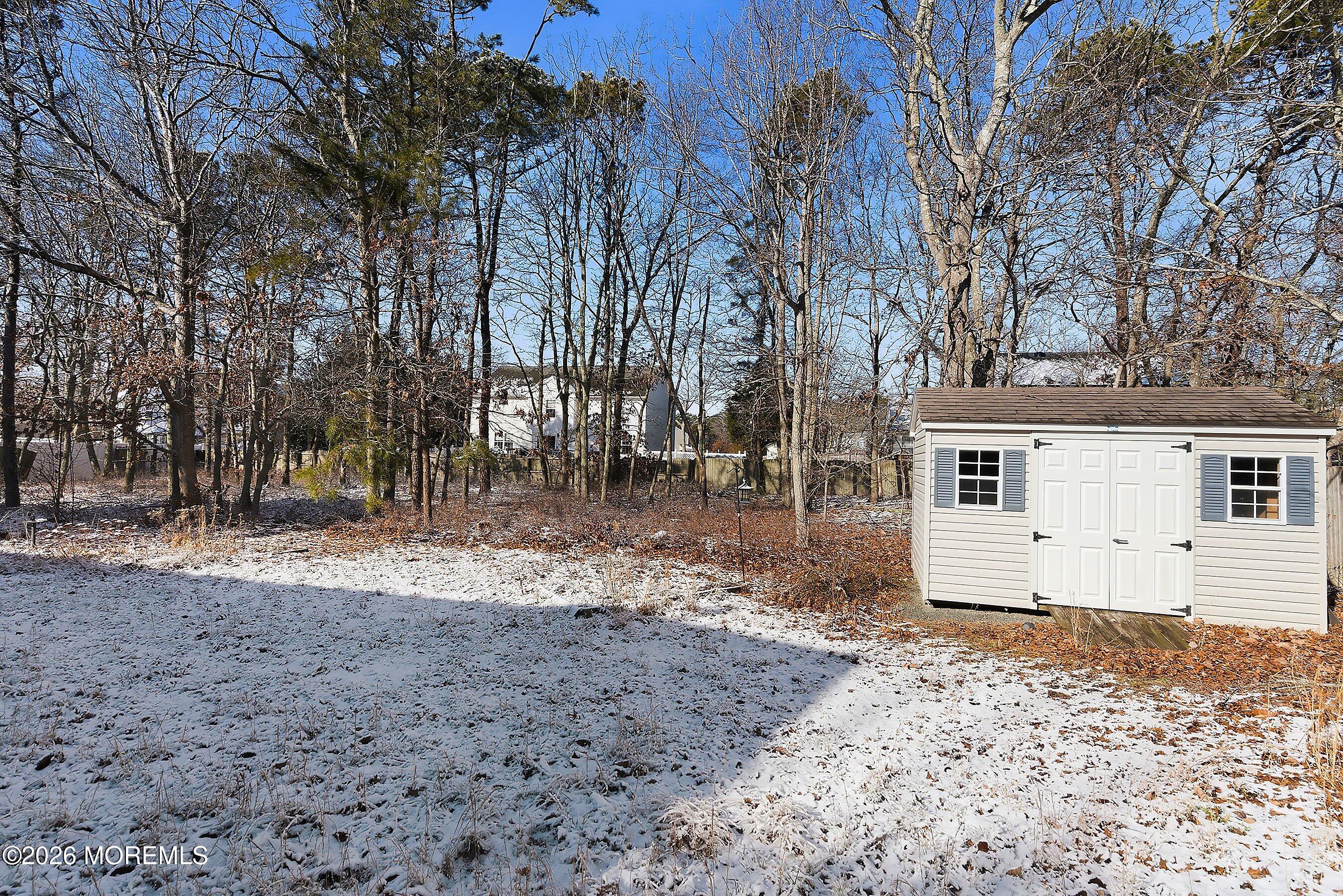 15 Benjamin Court Barnegat, NJ 08005 - Photo 24 of 24 a view of a backyard with large trees