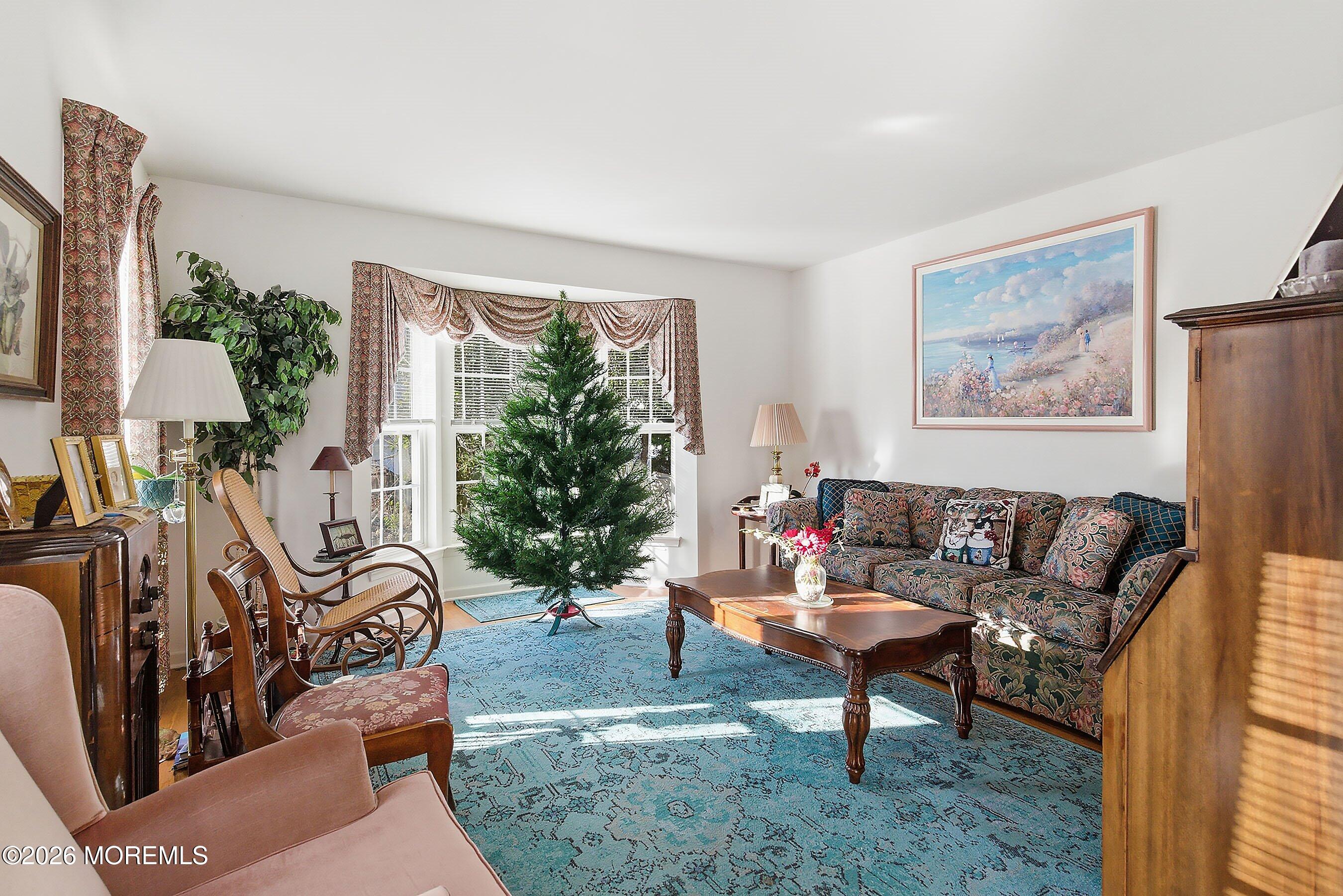15 Benjamin Court Barnegat, NJ 08005 - Photo 5 of 24 a living room with furniture and a large window