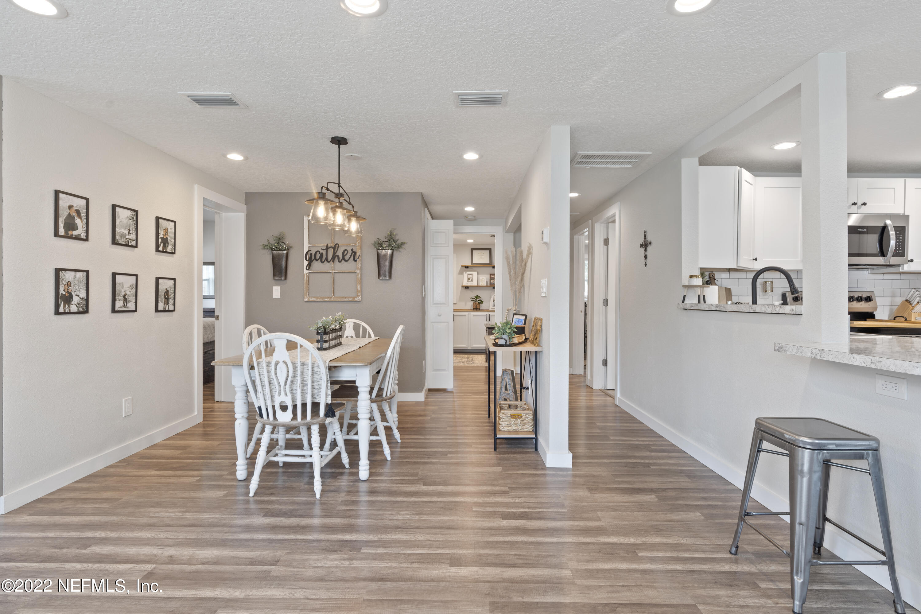 1032 Prince Road St. Augustine, FL 32086 - Photo 22 of 39 a view of a dining room with furniture and wooden floor
