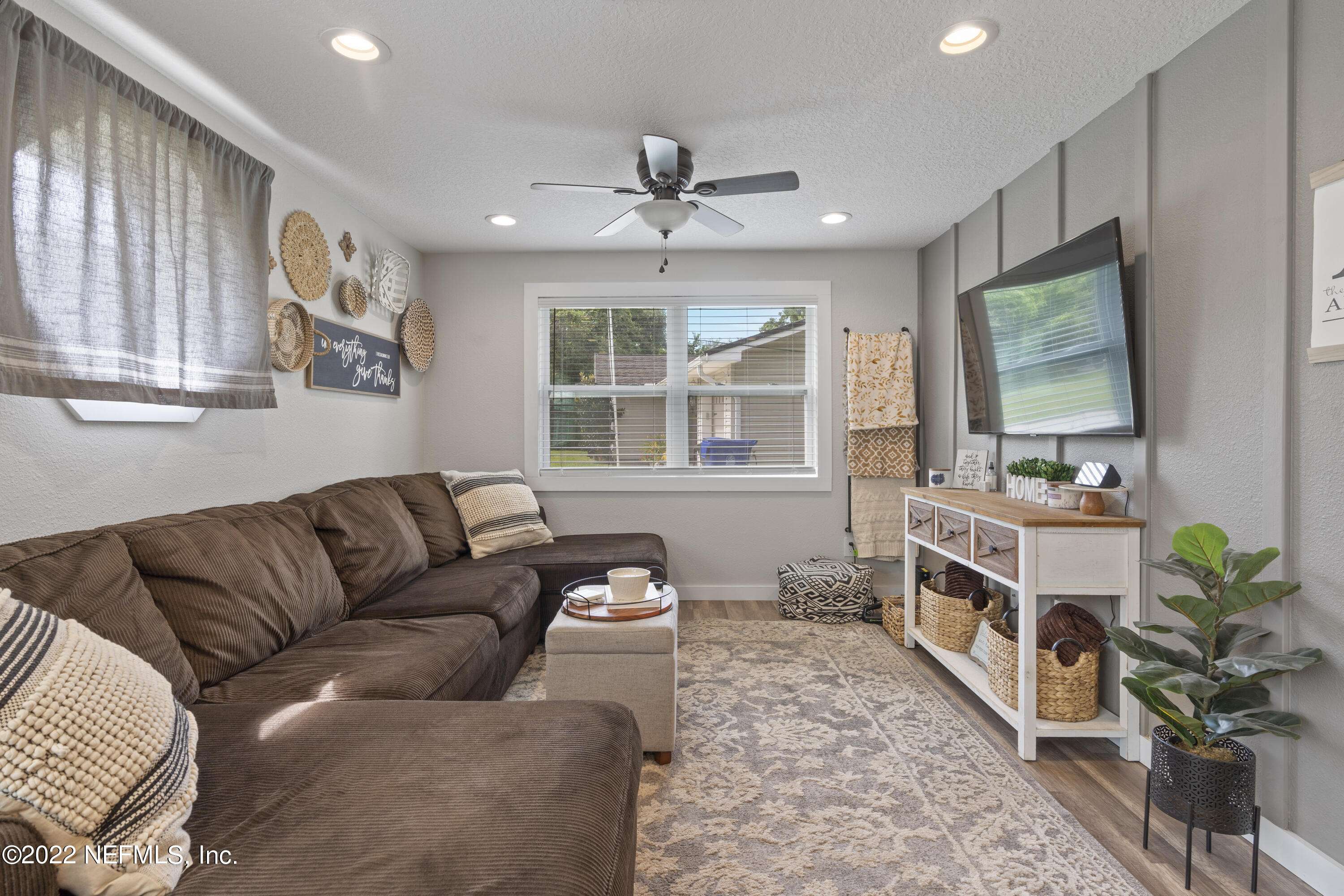 1032 Prince Road St. Augustine, FL 32086 - Photo 24 of 39 a living room with furniture and a flat screen tv