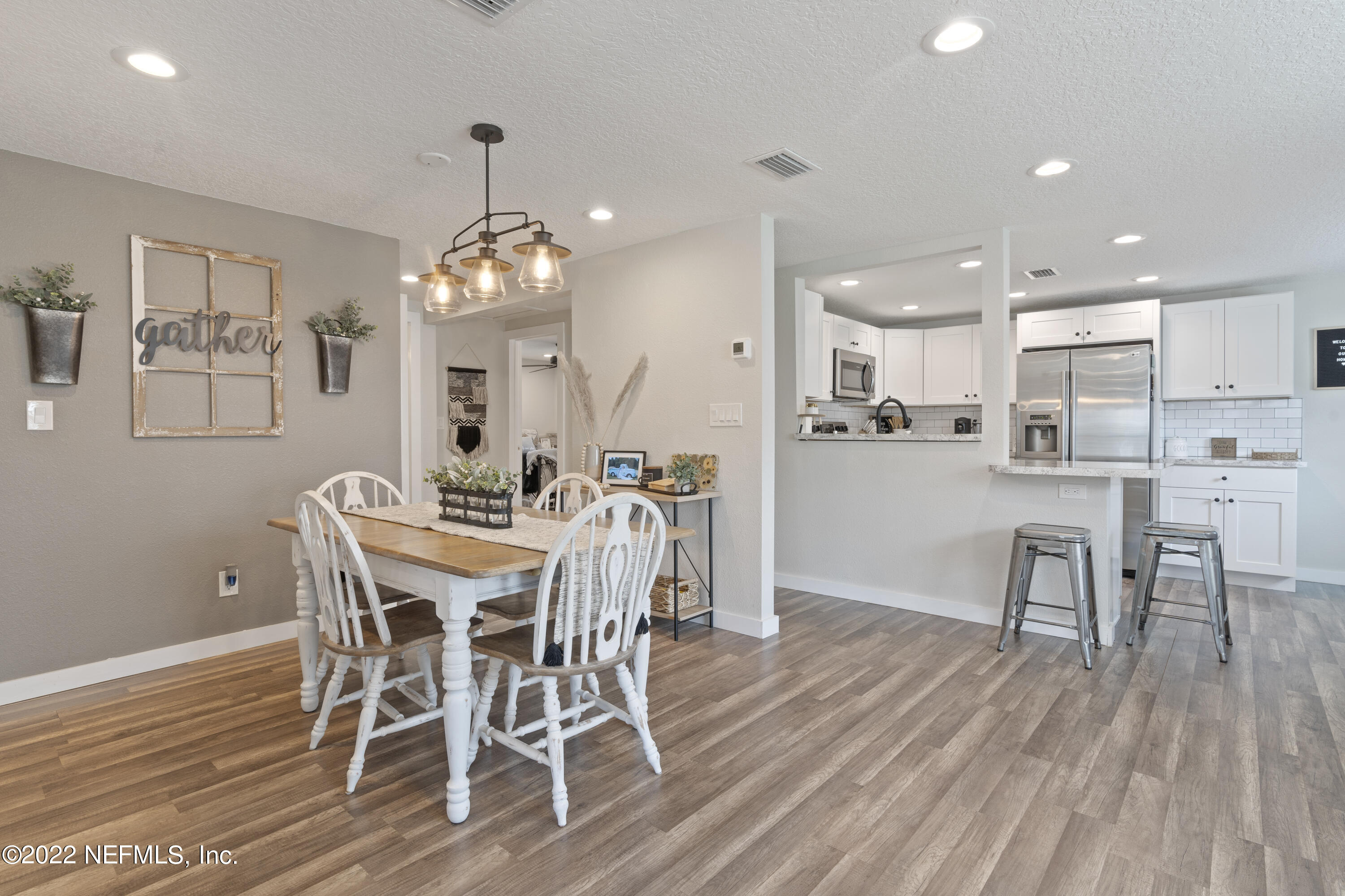1032 Prince Road St. Augustine, FL 32086 - Photo 25 of 39 a view of a dining room with furniture and wooden floor