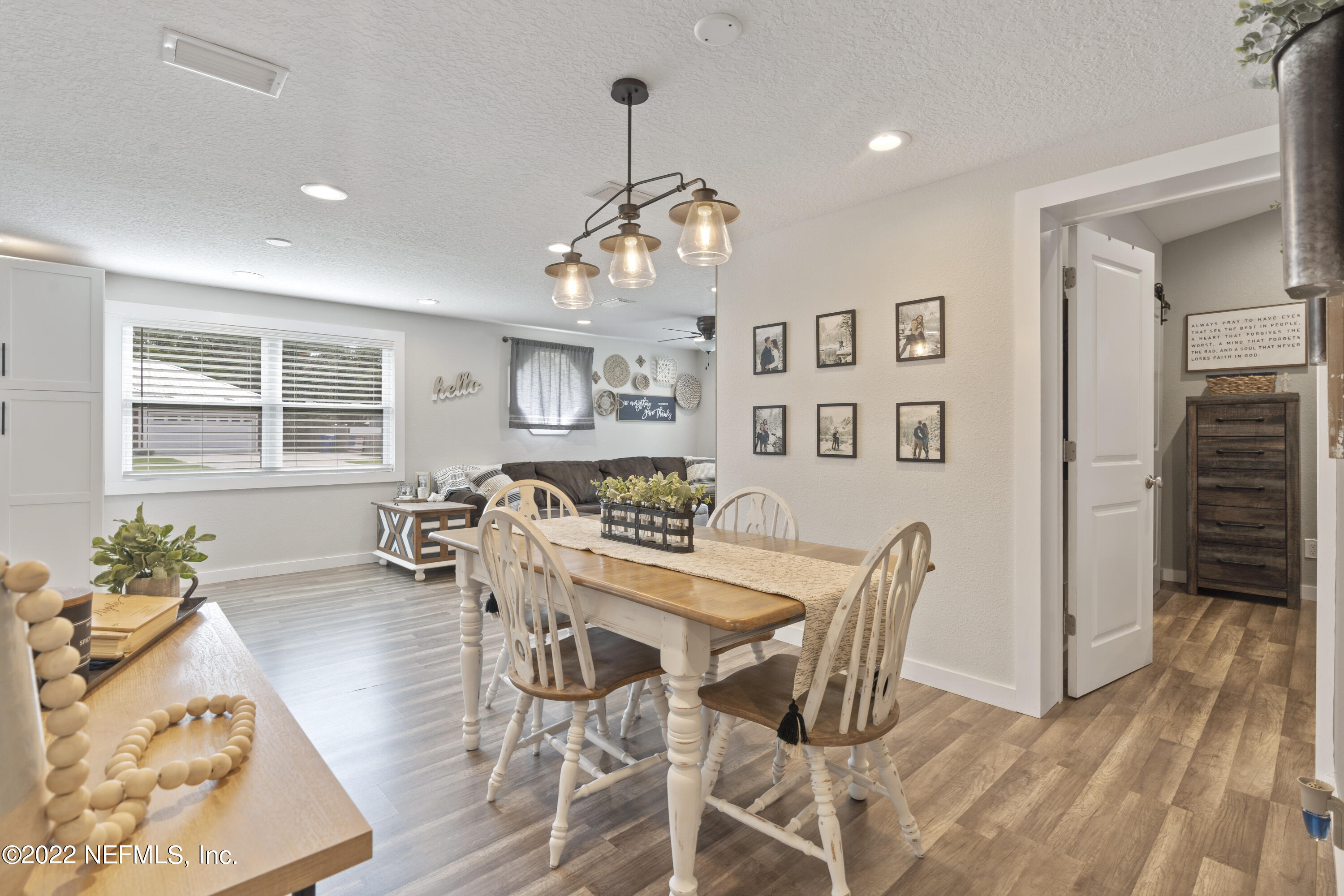 1032 Prince Road St. Augustine, FL 32086 - Photo 26 of 39 a view of a dining room with furniture window and wooden floor