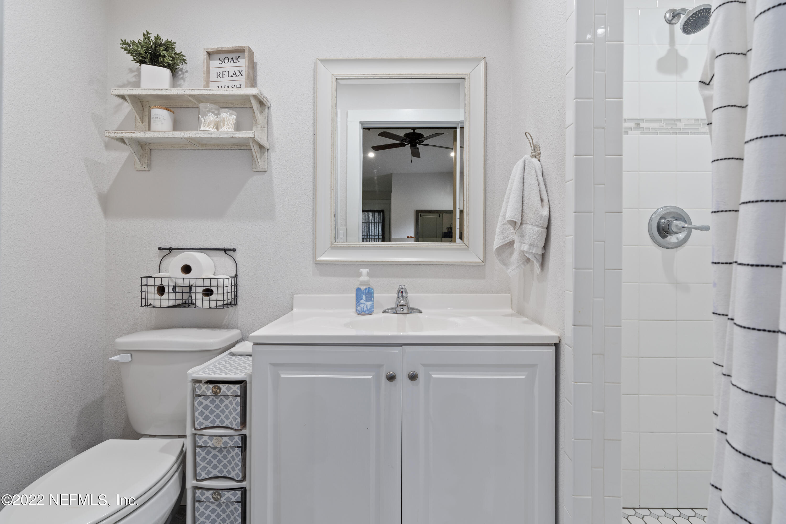 1032 Prince Road St. Augustine, FL 32086 - Photo 31 of 39 a bathroom with a sink toilet and mirror