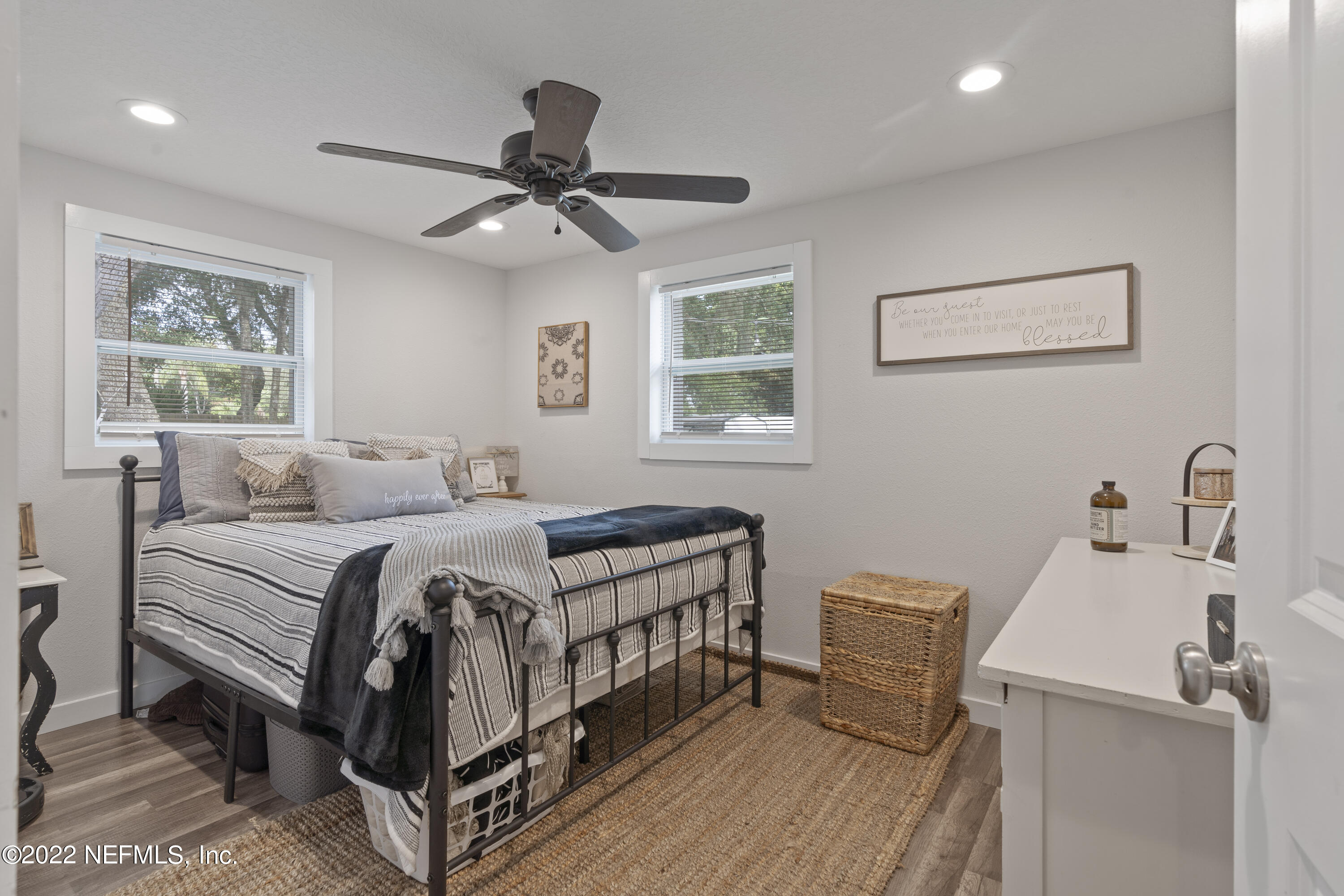 1032 Prince Road St. Augustine, FL 32086 - Photo 32 of 39 a bedroom with a bed and a chandelier
