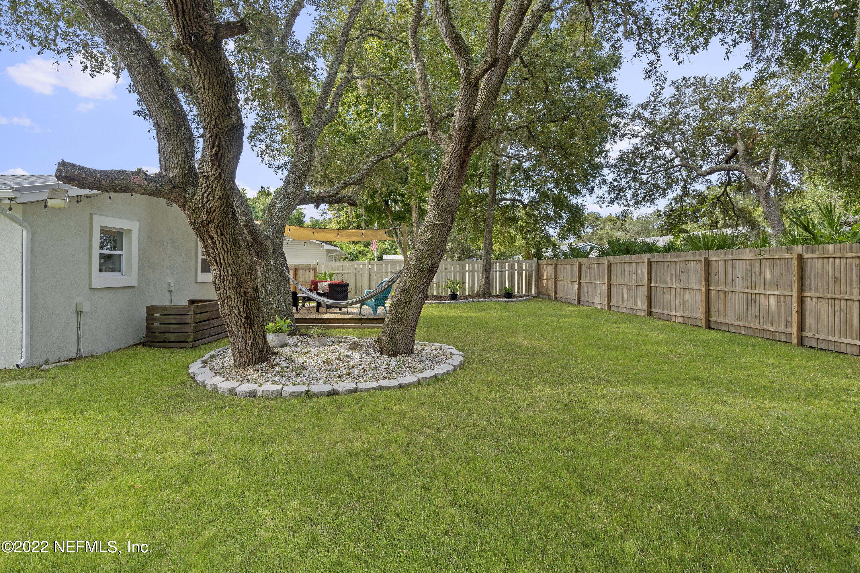 1032 Prince Road St. Augustine, FL 32086 - Photo 9 of 39 a view of a house with backyard and a tree
